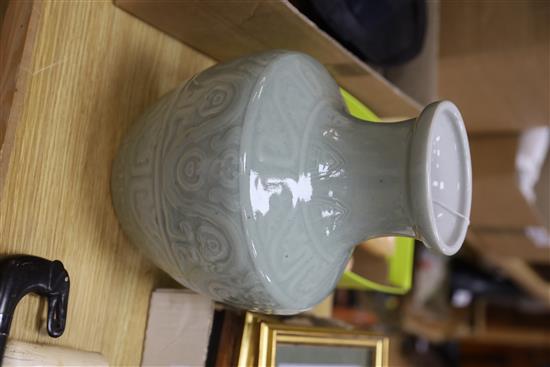 A Chinese celadon glazed archaistic moulded vase, Qianlong underglaze blue seal mark to base, probably 19th century, H.30cm